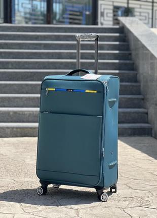 Середня валіза дорожня тканинна m golden horse на колесах  з підшипником6 фото
