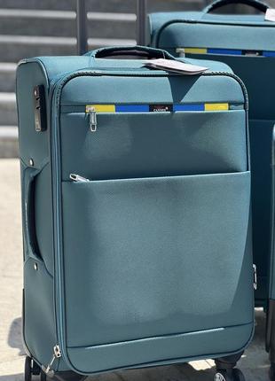 Середня валіза дорожня тканинна m golden horse на колесах  з підшипником4 фото