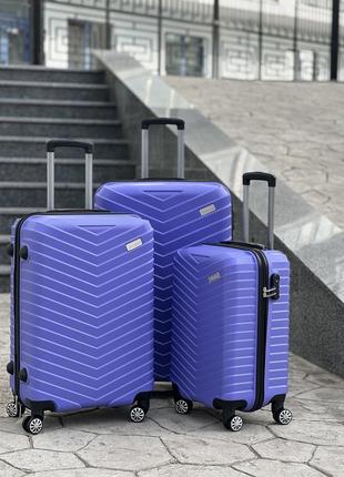 Ударопрочный пластиковый средний чемодан дорожный m на колесах 75 литров2 фото