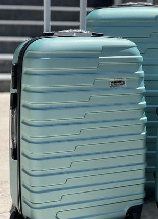 Ударопрочный пластиковый большой чемодан дорожный l на колесах 110 литров4 фото
