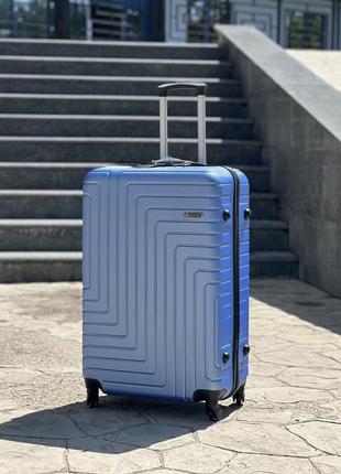 Ударопрочный пластиковый средний чемодан дорожный m на колесах 75 литров7 фото