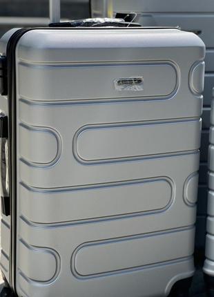 Ударопрочный пластиковый средний чемодан дорожный m на колесах 75 литров4 фото