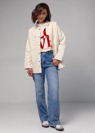 Жіноча джинсова куртка на кнопках4 фото