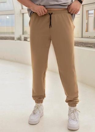 Чоловічі спортивні штани з резинкою та шнурком в поясі з кішенями з резинкою знизу3 фото