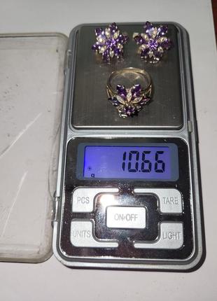 Комплект серебряных украшений с фиолетовыми камнями (серьги и кольцо)2 фото