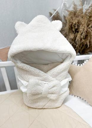 Конверт- одеяло с капешоном на выписку новорожденного с красивым бантом1 фото