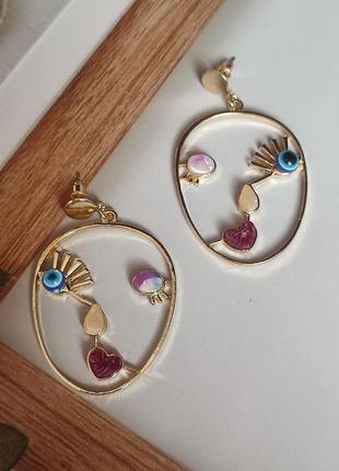 Креативные серьги лица