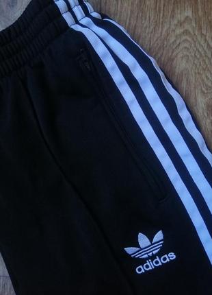 Штани adidas штани джинси2 фото