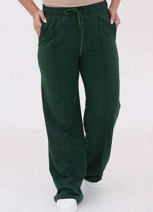 Жіночі весняні спортивні штани в стилі карго з двонитки з кишенями розміри 46-568 фото