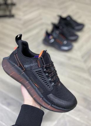 Кросівки чоловічі чорно-помаранчеві reebok kinetica