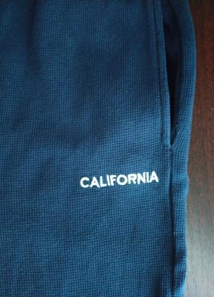 Спортивные штаны  темно синего цвета.мелкий рубчик. длина 91 см  талия ниже резинки 33 см8 фото
