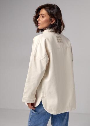 Жіноча джинсова куртка на кнопках2 фото