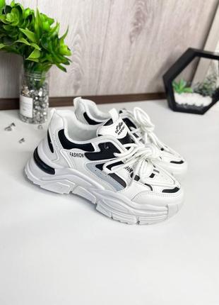 Стильні біленькі кросівки.1 фото