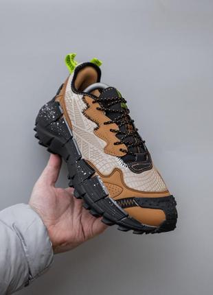 Чоловічі кросівки коричневі з чорним reebok zig kinetica 2.5 edge7 фото