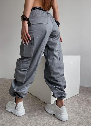 Жіночі штани карго з накладними кишенями, штани карго з карманами1 фото