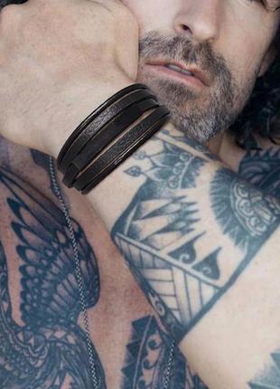 Мужской кожаный браслет плетеный, черный с металлическим вставками10 фото