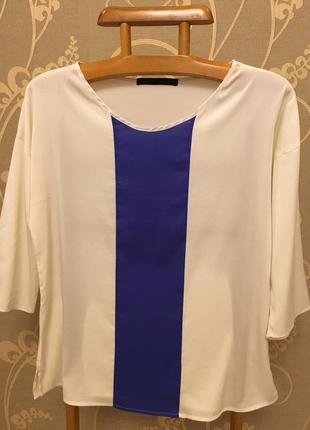 Очень красивая и стильная брендовая двухцветная блузка.1 фото