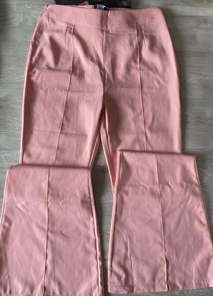 Необычные розовые брюки клеш2 фото
