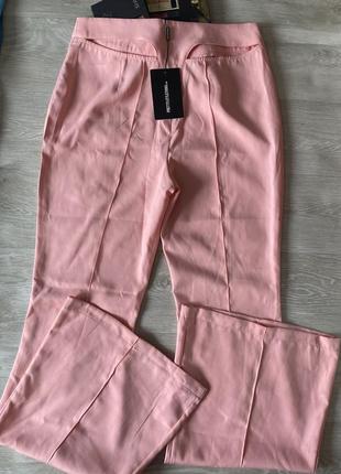 Необычные розовые брюки клеш4 фото