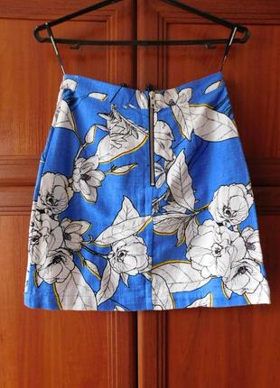 Голубая юбка с белыми цветами1 фото