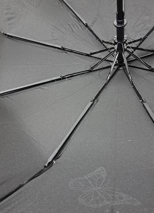 Чорна складна жіноча парасолька з квітами7 фото