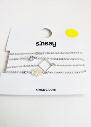 Комплект сріблястих браслетів sinsay2 фото