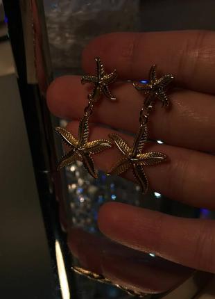 Сережки морські зірки золотистого кольору6 фото