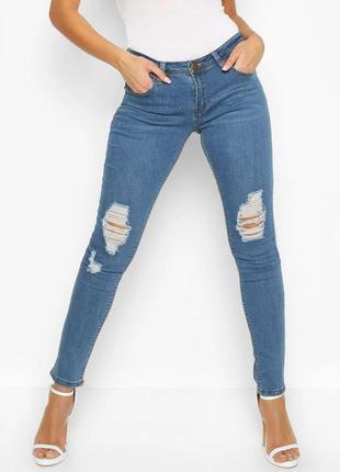 Стрейчові джинси бохо з рваними колінами1 фото