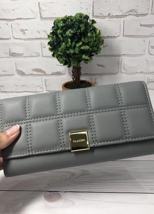 Стильный женский кошелек серого цвета1 фото