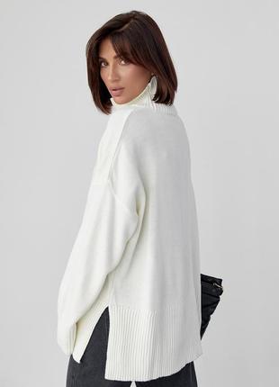 Женский вязаный свитер oversize с разрезами по бокам - молочный цвет, s (есть размеры)4 фото