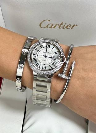 Часы наручные женские круглые серебристые с камнями в стиле cartier3 фото