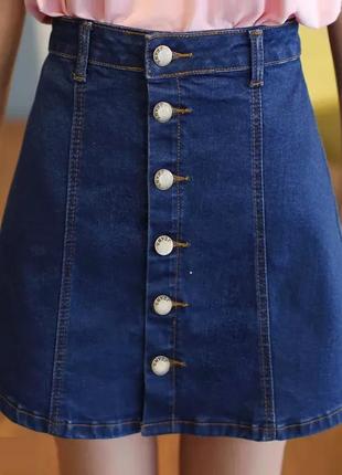 Джинсовая женская юбка трапеция на пуговицах темно синяя4 фото