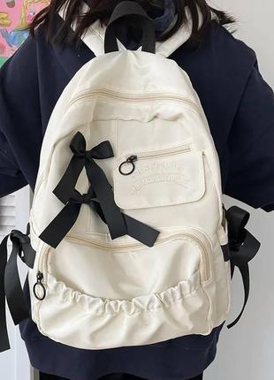 Школьный рюкзак для девочки бежевый с бантиками красивый удобный вместительный10 фото