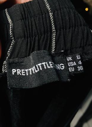 Укороченные чёрные брюки в полоску prettylittlething s8 фото