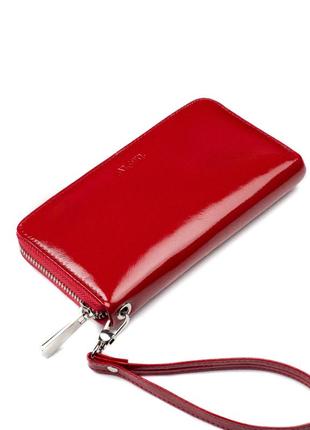 Жіночий шкіряний червоний гаманець на блискавці.