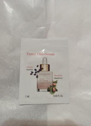 Тональна основа clarins tinted oleo-serum1 фото