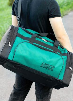 Спортивна дорожня сумка nike чоловіча тканинна зелена для тренувань в залі на 60 літрів7 фото