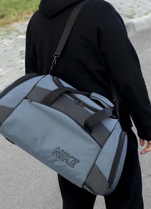 Спортивная дорожная сумка nike тканевая серая для тренажерного зала мужская на 55 литров5 фото