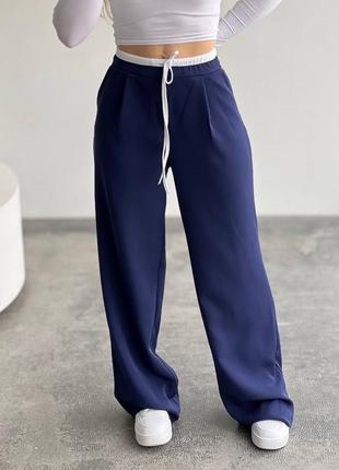 Штани в стилі бренду з подвійним поясом з кишенями, жіночі брюкина весну1 фото