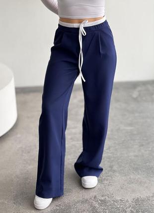 Штани в стилі бренду з подвійним поясом з кишенями, жіночі брюкина весну2 фото