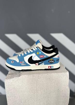 Кроссовки nike sb dunk low racing uncle sand scorcher university blue black