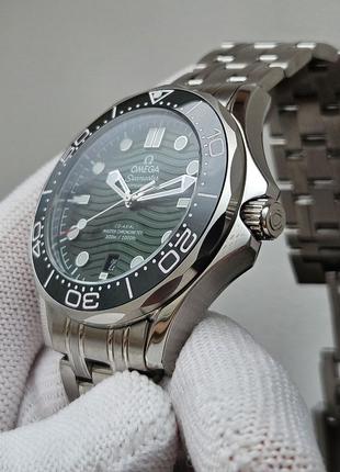 Omega seamaster green 300m7 фото