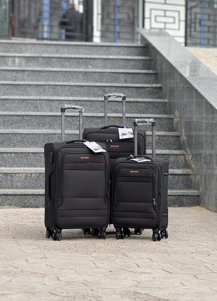 Середня валіза дорожня тканинна m horoso на колесах  з підшипником 4 колеса1 фото