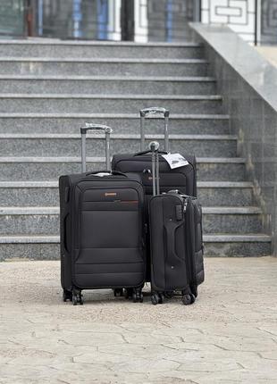 Средний чемодан дорожный тканевый m horoso на колесах  с подшипником 4 колеса2 фото