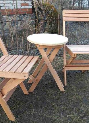 Набір дерев'яних розкладних меблів (стіл +2 стільці)1 фото