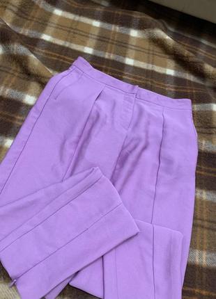 Фіолетові брюки