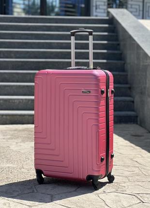 Ударопрочный пластиковый средний чемодан дорожный m на колесах 75 литров6 фото