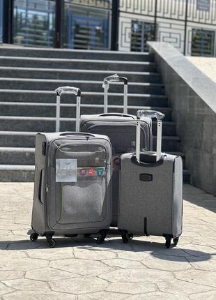 Полегшена середня валіза дорожня тканинна m nuri на колесах  з підшипником3 фото