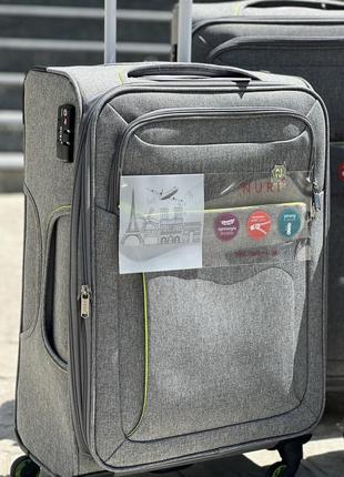 Полегшена середня валіза дорожня тканинна m nuri на колесах  з підшипником4 фото