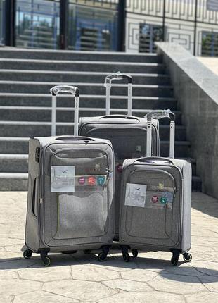 Полегшена середня валіза дорожня тканинна m nuri на колесах  з підшипником